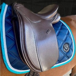 Brown saddle with blue saddlecloth